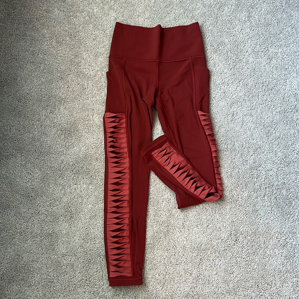 Athleta SALUTATION STASH‎ HIGH RISE 7/8 LEGGING burnt orange